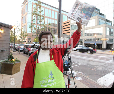 Former St. Louis Cardinals and member of the National Baseball Hall of Fame Lou Brock, stands on the street corner selling newspapers on Old Newsboys Day in Clayton, Missouri on November 17, 2016. Funds collected on Old Newsboys Day, goes to over 200 children's charities in the St. Louis area. Photo by Bill Greenblatt/UPI Stock Photo