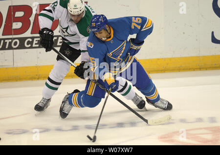 St. Louis Blues Ryan Reaves tries to keep his balance as Dallas Stars Radek Faksa of the Czech Republic goes after the puck in the first period at the Scottrade Center in St. Louis on January 7, 2017.   Photo by Bill Greenblatt/UPI Stock Photo