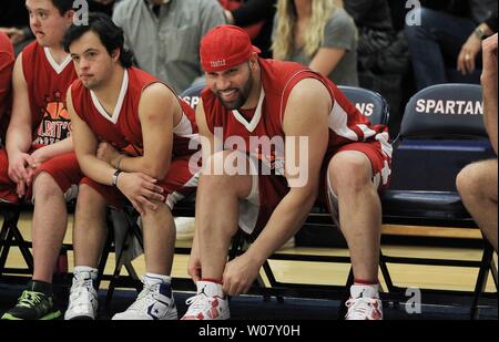 Anaheim Angels slugger Albert Pujols cheers on his team during the annual Albert  Pujols Basketball Shoot Out All Star Game in Town and Country, Missouri on  November 24, 2013. A special team