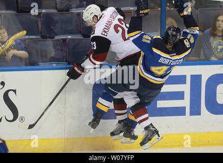 Arizona Coyotes Oliver Ekman-Larsson and St. Louis Blues Robert Bortuzzo collide during the first period at the Scottrade Center in St. Louis on March 27, 2017. Photo by Bill Greenblatt/UPI Stock Photo