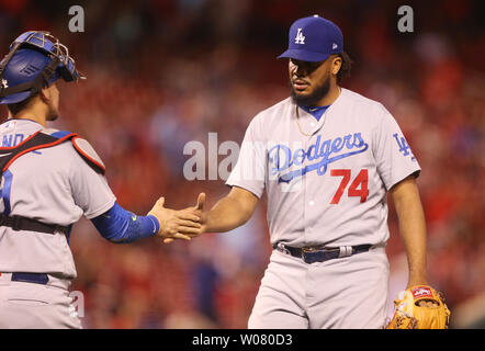 Los Angeles Dodgers pitcher Kenley Jansen and catcher Yasmani Grandal shake hands after the third out and a 9-4 win over the St. Louis Cardinals at Busch Stadium in St. Louis on May 30, 2017.   Photo by Bill Greenblatt/UPI Stock Photo