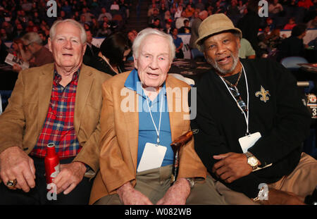 NFL Football Hall of Fame member Jackie Smith (L) enjoys the annual Guns and Hoses Boxing Showdown with former head football coach Jim Hanifan and former running back Johnny Roland (R) all teammates during the old St. Louis Football Cardinals days, at the Scottrade Center in St. Louis on November 22, 2017. The boxing event helps support Backstoppers, an organization that assists the families of first responders killed in the line of duty.  Photo by Bill Greenblatt/UPI Stock Photo