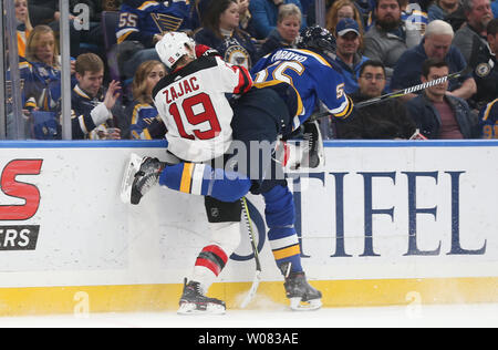 St. Louis Blues Colton Parayko throws himself into New Jersey Devils Travis Zajac in the first period at the Scottrade Center in St. Louis on January 2, 2018.  Photo by BIll Greenblatt/UPI Stock Photo