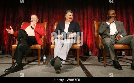 Former St. Louis Cardinals first baseman Keith Hernandez and former center  fielder Willie McGee (R) listen as their manager Whitey Herzog tells a  story, during a fund raising dinner to benefit children