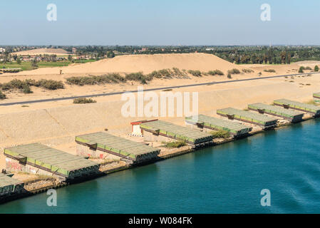 Ismailia, Egypt - November 5, 2017: Pontoons bridge for crossing the Suez Canal lie on the shore of canal near Ismailia, Egypt. Stock Photo