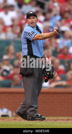 Home plate umpire Chris Guccione tries to explain to St. Louis Cardinals Dexter Fowler why he was tagged out at third base in the fifth inning against the Cincinnati Reds  at Busch Stadium in St. Louis on July 14, 2018. Photo by Bill Greenblatt/UPI Stock Photo