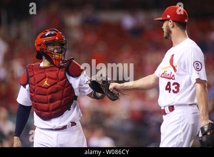 St. Louis Cardinals pitcher Dakota Hudson and catcher Yadier Molina tap gloves after getting out of a jam in the eighth inning against the Pittsburgh Pirates at Busch Stadium in St. Louis on August 28, 2018. St.Louis defeated Pittsburgh 5-2.   Photo by Bill Greenblatt/UPI Stock Photo