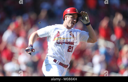 St. Louis Cardinals Patrick Wisdom (R) and Yairo Munoz rip the shirts from  the back of Tyler O'Neill after O'Neill hit a walk off home run against the  San Francisco Giants in