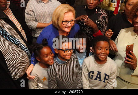 U.S. Senator Claire McCaskill stops for a photo with children during one of her last fundraisers in St. Louis on November 4, 2018. McCaskill is taking on Missouri Attorney General Josh Hawley is a tightly contested race in Missouri, considered to be a tie at this point and one of the most expensive Senate races in the country. McCaskill, a democrat, has been in the U.S. Senate for 12 years. Photo by Bill Greenblatt/UPI Stock Photo