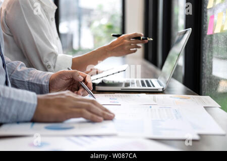 Businessman accountant and secretary making working audit and calculating expense financial annual financial report balance sheet statement, doing fin Stock Photo