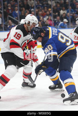 New Jersey Devils Travis Zajac battles St. Louis Blues Ryan O'Reilly for control of the faceoff in the first period at the Enterprise Center in St. Louis on February 12, 2019. St. Louis defeated New Jersey 8-3. Photo by Bill Greenblatt/UPI Stock Photo