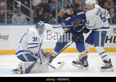 Toronto Maple Leafs goaltender Frederik Andersen of Denmark keeps an eye on the puck as St. Louis Blues Tyler Bozak and Leafs Jake Gardiner battle for position in the first period at the Enterprise Center in St. Louis on February 19, 2019. Photo by Bill Greenblatt/UPI Stock Photo