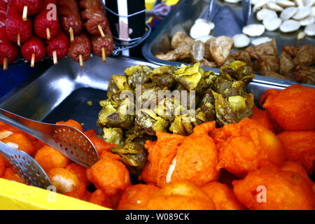 Photo of assorted deep fried snack food in street food cart Stock Photo