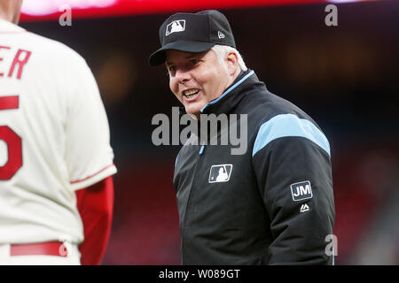 Major League umpire Tim Timmons jokes with St. Louis Cardinals third base coach Ron 'Pop' Warner during a game against the Pittsburgh Pirates at Busch Stadium in St. Louis on May 11, 2019.   Photo by Bill Greenblatt/UPI Stock Photo