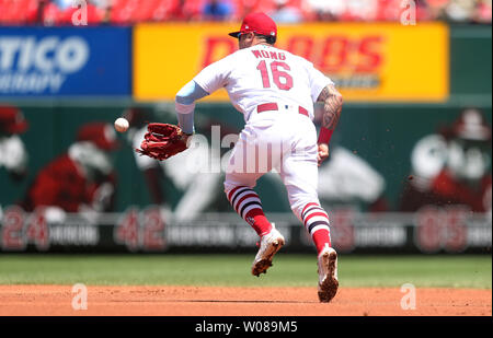 St. Louis, United States. 25th Aug, 2020. St. Louis Cardinals Kolten Wong  throws the baseball to first base to get Kansas City Royals Nicky Lopez in  the second inning at Busch Stadium