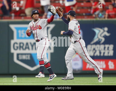 Atlanta Braves Ronald Acuna Jr. (L) and Nick Markakis slap gloves after the third out and a 4-3 win over the St. Louis Cardinals in ten innings at Busch Stadium in St. Louis on May 26, 2019. Photo by Bill Greenblatt/UPI Stock Photo