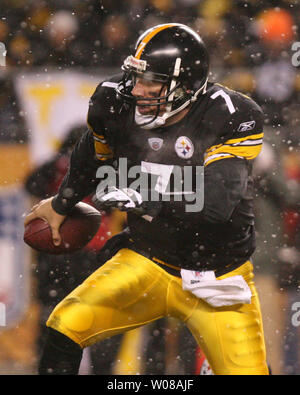 Cincinnati Bengals Michael Johnson holds on the jersey and sacks Pittsburgh  Steelers quarterback Ben Roethlisberger for a lost of eight yards in the  second quarter at Heinz Field in Pittsburgh, Pennsylvania on