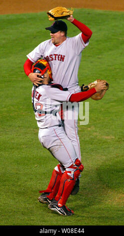 Boston Red Sox catcher Jason Varitek lifts pitcher Derek Lowe after he struck out the last Oakland A's batter to win in Oakland,  Ca., on October 6, 2003. The Red Sox defeated the Oakland A's 4-3 to advance to the ALCS against the Yankees.   (UPI/TERRY SCHMITT) Stock Photo