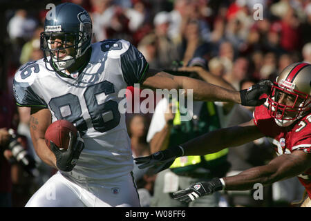 Seattle Seahawks' TE Jerramy Stevens (86) tries to push away San Francisco 49ers' Ben Emanuel at Monster Park in San Francisco on November 20, 2005.   (UPI Photo/Terry Schmitt) Stock Photo