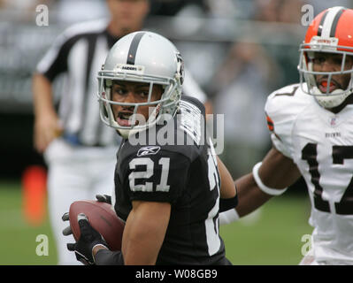 Cleveland Browns QB Charlie Frye is sacked by Oakland Raiders Derrick  Burgess (56) for a 9 yard loss in the second quarter at McAfee Coliseum in  Oakland, California on October 1, 2006.