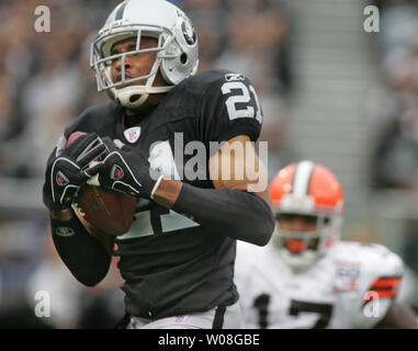 Cleveland Browns QB Charlie Frye (9) rolls out to pass against the