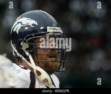 Former Denver Broncos center Tom Nalen talks to the crowd during a ceremony  where Nalen was inducted into the Denver Broncos Ring of Fame at an NFL  football game between the Denver