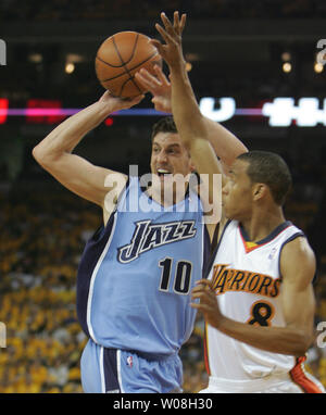 Utah Jazz Gordan Giricek (10) of Croatia looks to pass as he is guarded by  Golden State Warriors Monta Ellis in the first half of game three of the  Western Conference semifinals