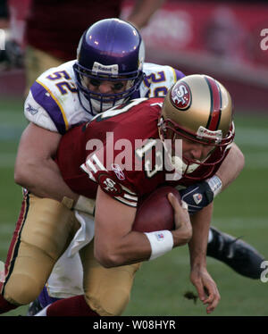 Washington Redskins Darrel Young is tackled by Minnesota Vikings' Jamarca  Sanford (33) and Chad Greenway (52) during the third quarter at FedEx Field  in Landover, Maryland on December 24, 2011. UPI/Kevin Dietsch