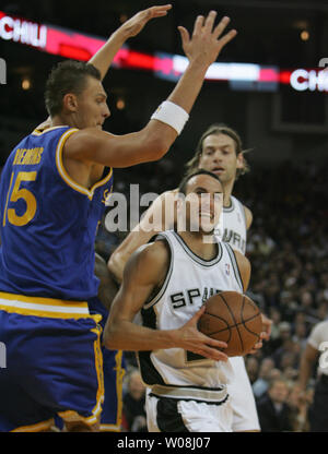 San Antonio Spurs Manu Ginobili (R) of Argentina has the way to the basket  blocked by Golden State Warriors Andris Biedrins at the Oracle Coliseum in Oakland, California on December 11, 2007.  (UPI Photo/Terry Schmitt) Stock Photo