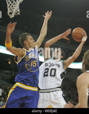 San Antonio Spurs Manu Ginobili (20) of Argentina puts up a shot against Golden State Warriors Andris Biedrins in the first half at the Oracle Arena in Oakland, California on January 7, 2008.  (UPI Photo/Terry Schmitt) Stock Photo