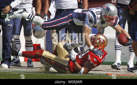 New England Patriots Wes Welker (83) dives over San Francisco 49ers Donald Strickland for a first down in the first quarter at Candlestick Park in San Francisco on October 5, 2008. The Patriots defeated the 49ers 30-21.   (UPI Photo/Terry Schmitt) Stock Photo