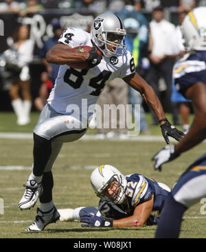 San Diego Chargers' Quentin Jammer intercepts a pass intended for Seattle  Seahawks' Mike Williams (17) as Chargers' Eric Weddle looks on in the first  half of an NFL football game, Sunday, Sept.