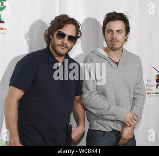 Joaquin Phoenix (L) and Casey Affleck arrive to participate in a staged reading of 'The World of Nick Adams', a performance to benefit Paul Newman's Hole in the Wall California Camp, The Painted Turtle, at Davies Symphony Hall in San Francisco on October 27, 2008.  (UPI Photo/Terry Schmitt) Stock Photo