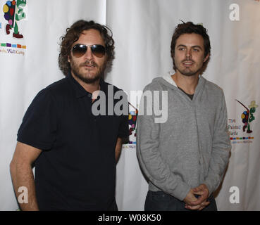 Joaquin Phoenix (L) and Casey Affleck arrive to participate in a staged reading of 'The World of Nick Adams', a performance to benefit Paul Newman's Hole in the Wall California Camp, The Painted Turtle, at Davies Symphony Hall in San Francisco on October 27, 2008.  (UPI Photo/Terry Schmitt) Stock Photo