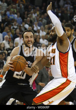 San Antonio Spurs Manu Ginobili (20) drives on Golden State Warriors Ronny Turiaf in the second half at Oracle Arena in Oakland, Califonia on February 2, 2009.  The Spurs won 110-105 in overtime.   (UPI Photo/ Terry Schmitt) Stock Photo