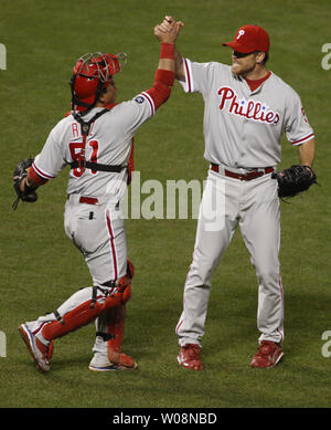 Philadelphia Phillies' Brad Lidge, right, and Carlos Ruiz celebrate after  winning Game 5 of the National League Championship baseball series against  the Los Angeles Dodgers Wednesday, Oct. 21, 2009, in Philadelphia. The