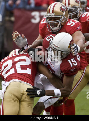 Arizona Cardinals WR Steve Breaston (15) is sandwiched by San Francisco 49ers Nate Clements (22) and Demetric Evans (93) for a one yard loss in the first quarter at Candlestick Park in San Francisco on January 2, 2011. The 49ers defeated the Cardinals 38-7.    UPI/Terry Schmitt Stock Photo