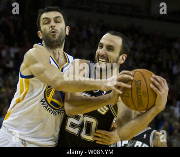 San Antonio Spurs Manu Ginobili (20) is fouled by Golden State Warriors Vladimir Radmanovic on his way to the basket in the first half at Oracle Arena in Oakland, California on January 24, 2011.   UPI/Terry Schmitt Stock Photo