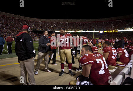 The San Francisco 49ers offensive line meets while play is stopped