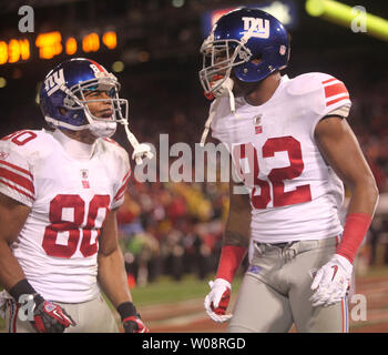 New York Giants Mario Manningham (82) celebrates with Victor Cruz (80)  after catching an Eli Manning pass in the fourth quarter against the San  Francisco 49ers in the NFC Championship at Candlestick