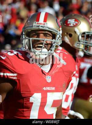 San Francisco 49ers WR Michael Crabtree (15) gains 19 yards on an Alex  Smith pass in the second quarter against the St. Louis Rams at Candlestick  Park in San Francisco on November