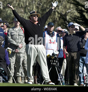 Actor Ray Romano watches his tee shot on the first hole of the 3M