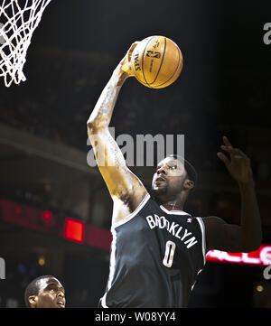 Brooklyn Nets Andray Blatche (0) goes up for a dunk against the Golden State Warriors in the first half at Oracle Arena in Oakland, California on February 22, 2014.  UPI/Terry Schmitt Stock Photo