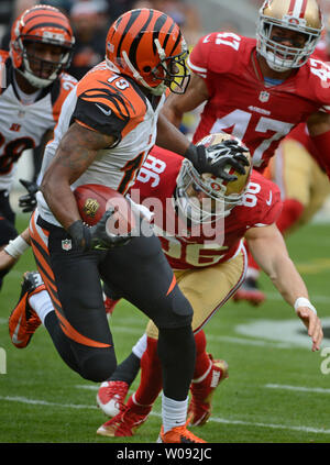 Cincinnati Bengals punt returner Brandon Tate (19) pushes off San Francisco 49ers Brandon Thompson (98) in the first quarter at Levi's Stadium in Santa Clara, California on December 20, 2015.     Photo by Terry Schmitt/UPI Stock Photo