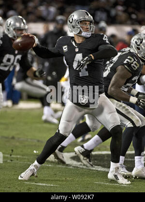 Oakland Raiders quarterback Derek Carr (4) passes in the second quarter against the San Diego Chargers at O.co Coliseum in Oakland, California on December 24, 2015. The Raiders defeated the Chargers 23-20 in overtime.    Photo by Terry Schmitt/UPI Stock Photo