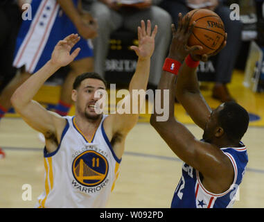 Golden State Warriors Klay Thompson (11) harasses Philadelphia 76ers Elton Brand in the second half at Oracle Arena in Oakland, California on March 27, 2016. Thompson scored 40 points in the Warriors 117-105 win.    Photo by Terry Schmitt/UPI Stock Photo