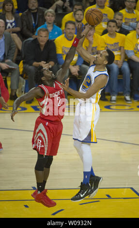 Golden State Warriors Shaun Livingston (34) shoots over Houston Rockets Patrick Beverley in the first period of game 5 of the NBA playoffs at Oracle Arena in Oakland, California on April 27, 2016.      Photo by Terry Schmitt/UPI Stock Photo