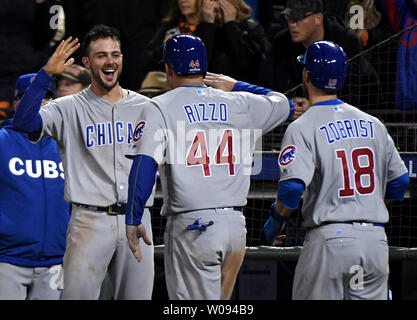 A color, born digital image of Kris Bryant #17 and Anthony Rizzo #44 of the  Chicago Cubs celebrating on the field after the Chicago Cubs defeat the  Washington Nationals during Game 5