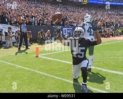 Oakland Raiders Michael Crabtree (15) celebrates with QB Derek Carr after a  two yard TD in the fourth quarter against the Atlanta Falcons at the  Coliseum in Oakland, California on September 18