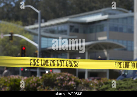 Fire caution tape blocks access to an active shooter incident at YouTube headquarters in San Bruno, California on April 3, 2018.     Photo by Terry Schmitt Stock Photo